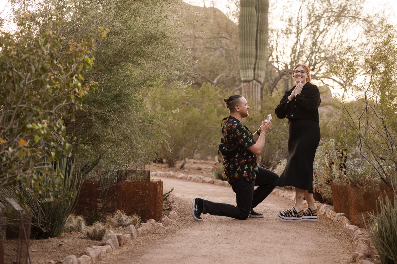 Brandon proposing to Karen in the desert